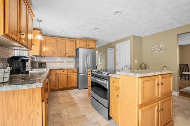 15 Hillside St, Rowley, MA 01969 - kitchen featuring appliances with stainless steel finishes, a kitchen island, tasteful backsplash, stone finish flooring, and recessed lighting