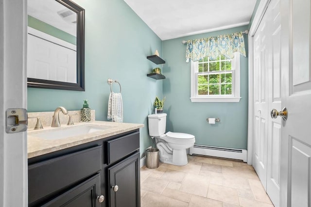 15 Hillside St, Rowley, MA 01969 - bathroom featuring baseboard heating, vanity, and stone finish flooring