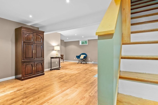 15 Hillside St, Rowley, MA 01969 - interior space featuring wood finished floors, a baseboard heating unit, and recessed lighting