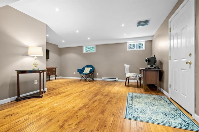15 Hillside St, Rowley, MA 01969 - living area with light wood finished floors, healthy amount of natural light, a baseboard heating unit, and recessed lighting