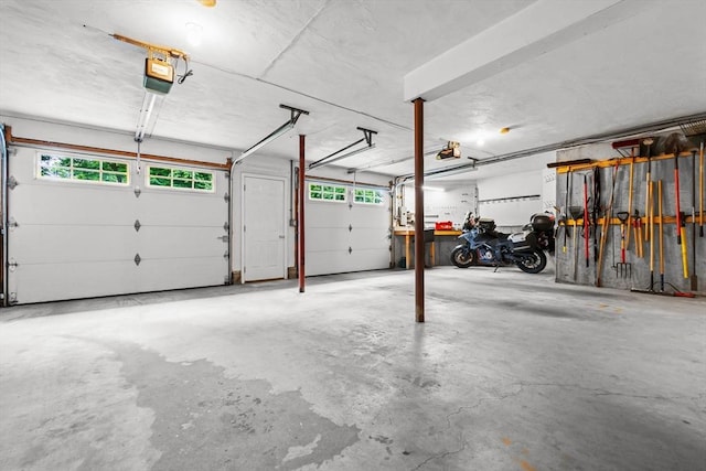 15 Hillside St, Rowley, MA 01969 - garage featuring a garage door opener
