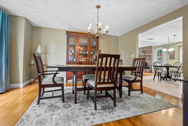 15 Hillside St, Rowley, MA 01969 - dining space with a chandelier and wood finished floors