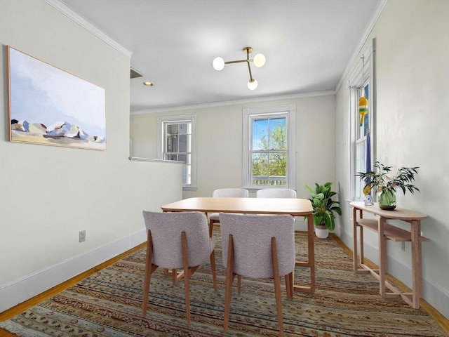 5 Tremont St Unit 3, Cambridge, MA 02139 - dining area featuring baseboards, wood finished floors, and ornamental molding