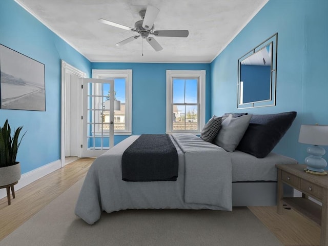 5 Tremont St Unit 3, Cambridge, MA 02139 - bedroom with wood finished floors, baseboards, and ceiling fan
