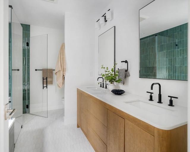 bathroom with vanity, toilet, and a shower with shower door