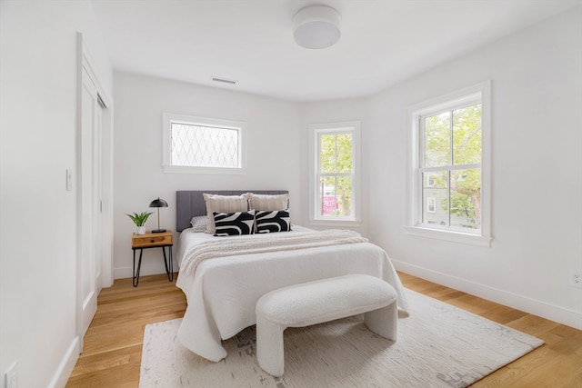 bedroom with light hardwood / wood-style floors