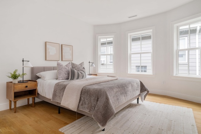 bedroom with light hardwood / wood-style floors