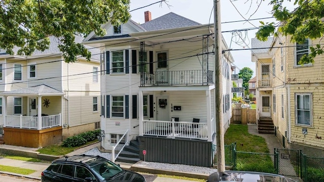 180 Irvington St, New Bedford, MA 02745 - view of front of home featuring a gate, a balcony, and roof with shingles