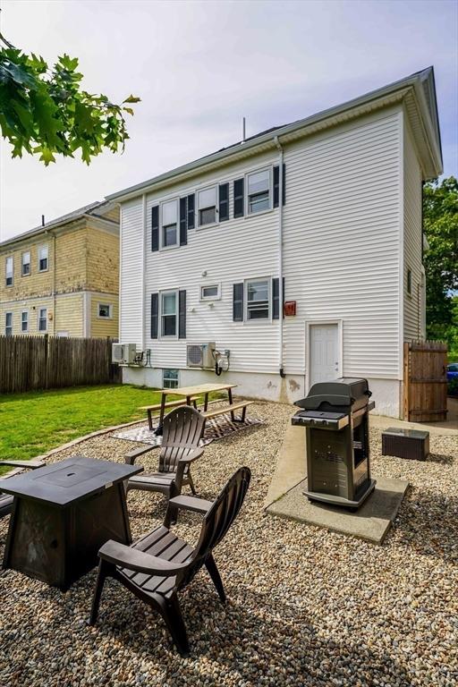 180 Irvington St, New Bedford, MA 02745 - rear view of house with a fire pit