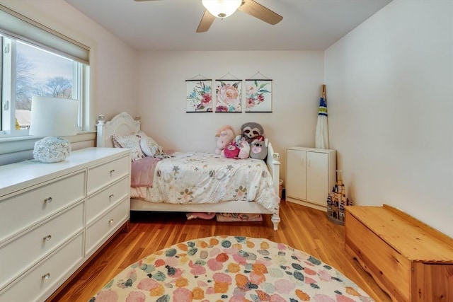 bedroom featuring light wood-style flooring and a ceiling fan