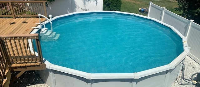 view of swimming pool featuring a deck