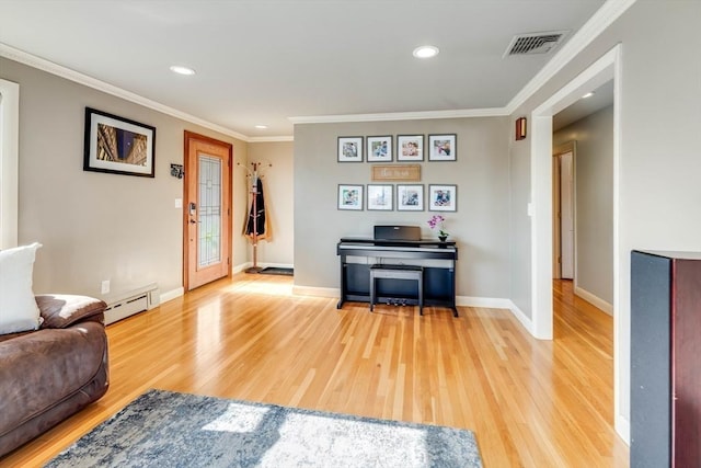 living area featuring visible vents, crown molding, light wood finished floors, baseboards, and baseboard heating