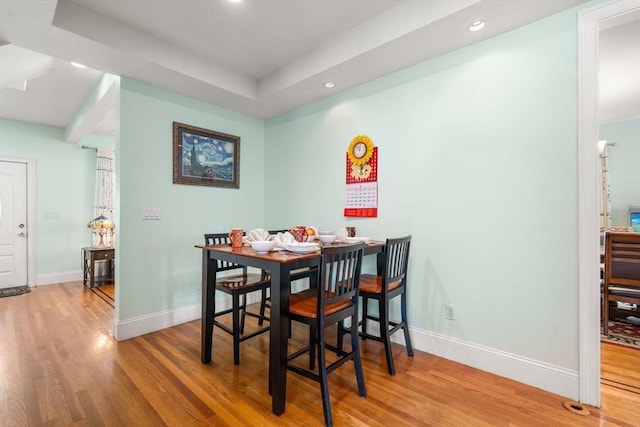 dining area with recessed lighting, baseboards, and wood finished floors