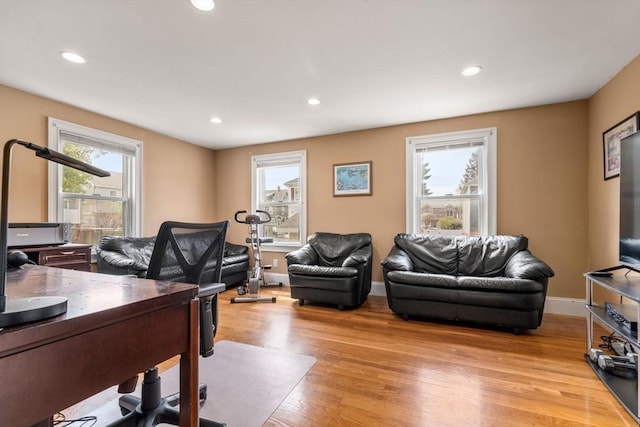 home office featuring recessed lighting, baseboards, and light wood-style floors