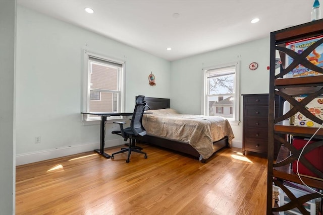 bedroom featuring baseboards, recessed lighting, and light wood finished floors