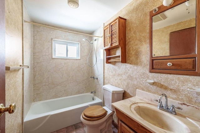 bathroom featuring toilet, tub / shower combination, and vanity