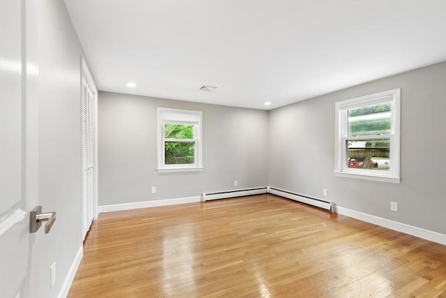 11 Williams St, Arlington, MA 02476 - spare room featuring light wood-style flooring, recessed lighting, and a baseboard radiator