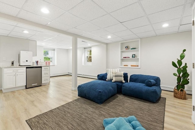 11 Williams St, Arlington, MA 02476 - living room featuring light wood-type flooring, wet bar, built in shelves, baseboard heating, and recessed lighting