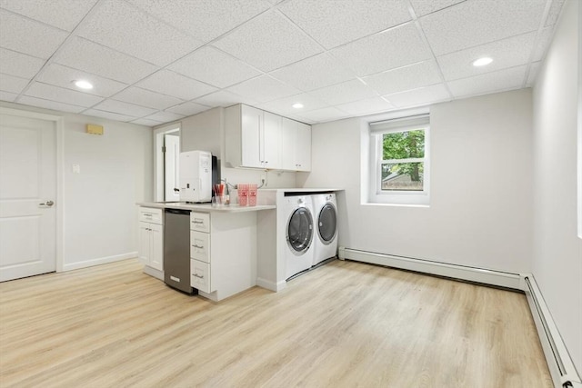 11 Williams St, Arlington, MA 02476 - washroom featuring washing machine and clothes dryer, a baseboard radiator, light wood finished floors, and recessed lighting