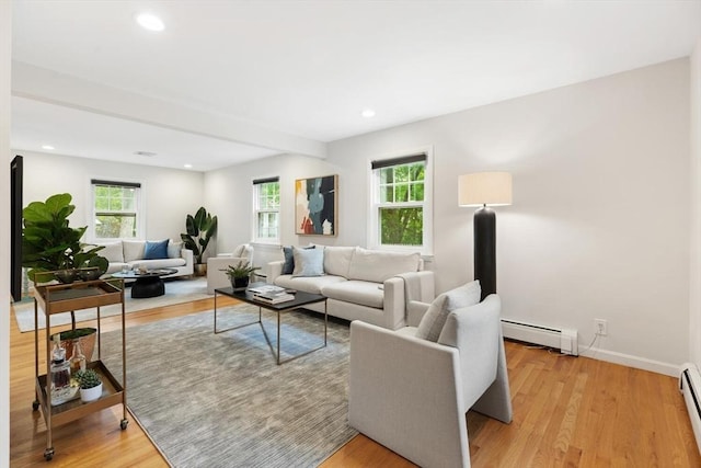 11 Williams St, Arlington, MA 02476 - living room with baseboard heating, a baseboard radiator, plenty of natural light, light wood finished floors, and recessed lighting