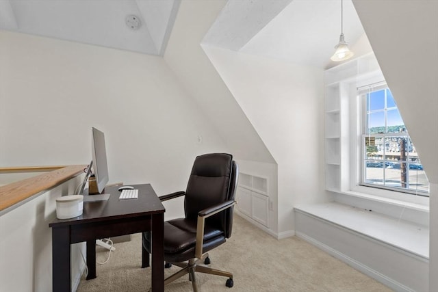 office area with lofted ceiling, light colored carpet, and baseboards