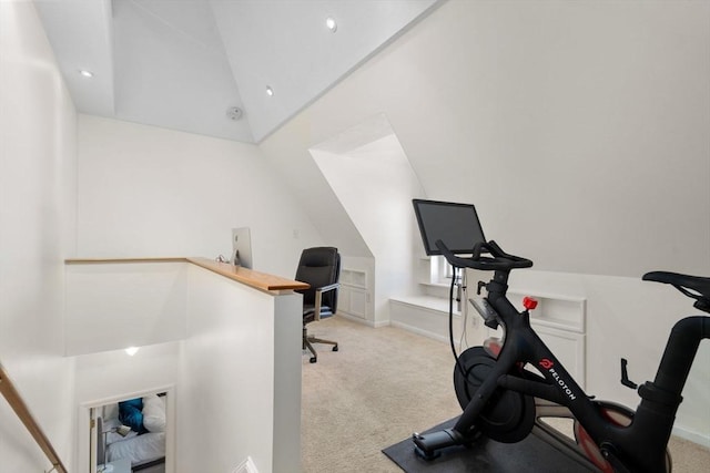 carpeted office space with lofted ceiling