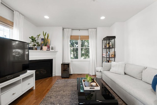 living area featuring a wealth of natural light, recessed lighting, and wood finished floors