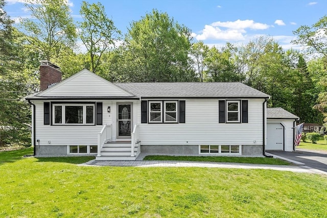 3 Hanson Rd, Wilmington, MA 01887 - view of front of home with a front yard, a chimney, a shingled roof, and view of wooded area