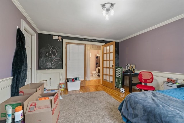 161 Old Farm Rd, Leominster, MA 01453 - bedroom with crown molding, wood finished floors, and a wainscoted wall