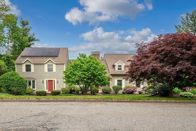 161 Old Farm Rd, Leominster, MA 01453 - view of front of home featuring solar panels and a chimney