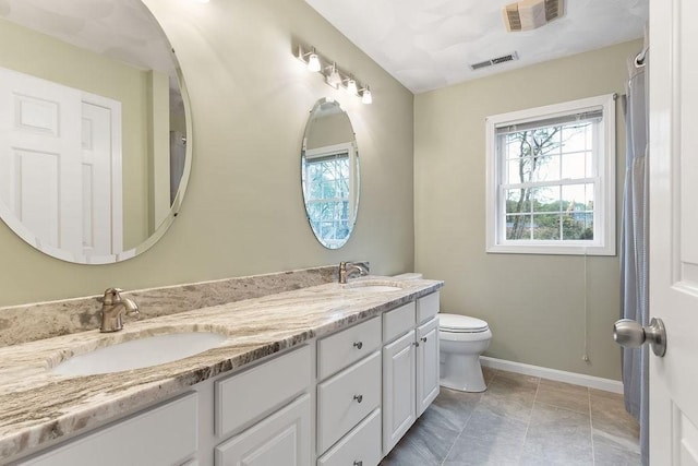 19 Miele Rd, Marlborough, MA 01752 - full bath with plenty of natural light, baseboards, toilet, and double vanity