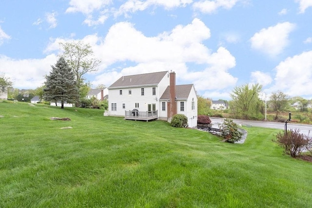 19 Miele Rd, Marlborough, MA 01752 - back of house with a chimney, a deck, and a yard