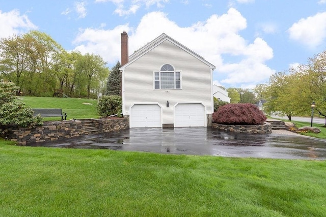 19 Miele Rd, Marlborough, MA 01752 - view of side of home featuring asphalt driveway, an attached garage, a chimney, and a yard