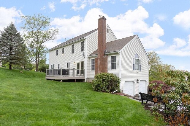 19 Miele Rd, Marlborough, MA 01752 - back of house featuring a chimney, an attached garage, a shingled roof, a yard, and a deck