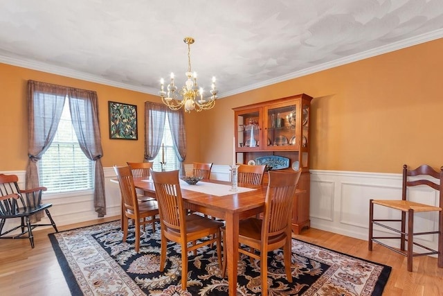 19 Miele Rd, Marlborough, MA 01752 - dining area with a chandelier, a wainscoted wall, crown molding, and light wood-type flooring