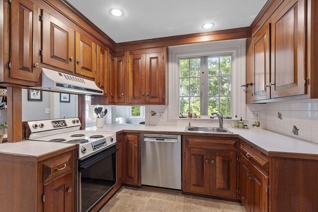 79 Cheever Cir, Andover, MA 01810 - kitchen with stainless steel dishwasher, electric range oven, a sink, range hood, and brown cabinetry