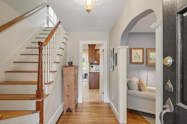 79 Cheever Cir, Andover, MA 01810 - foyer featuring wood finished floors, arched walkways, and stairs
