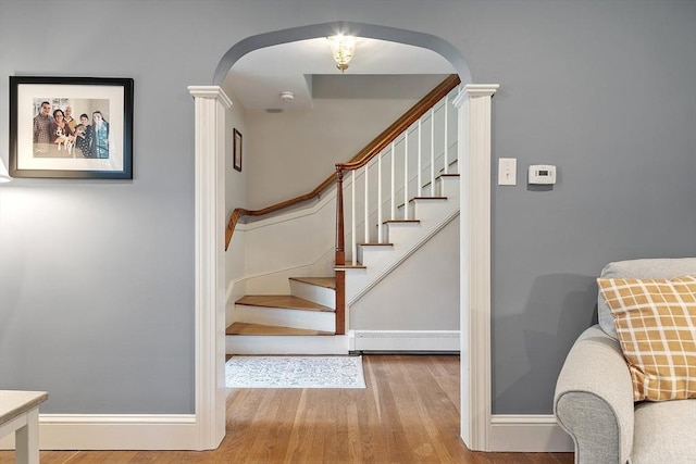 79 Cheever Cir, Andover, MA 01810 - stairs with arched walkways, wood finished floors, baseboards, and decorative columns