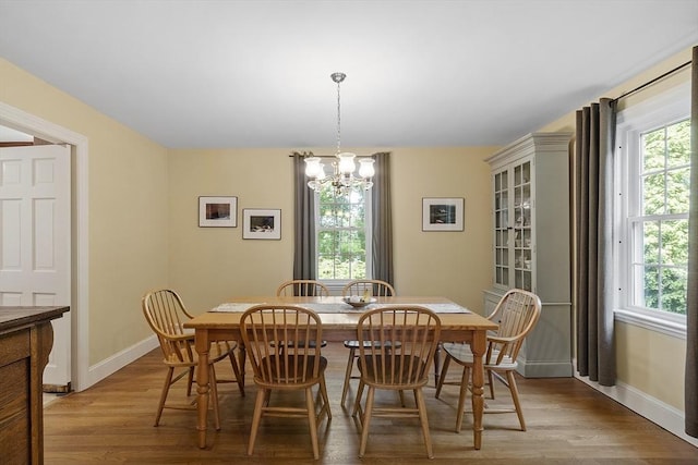 79 Cheever Cir, Andover, MA 01810 - dining space featuring a chandelier, light wood-style flooring, and healthy amount of natural light