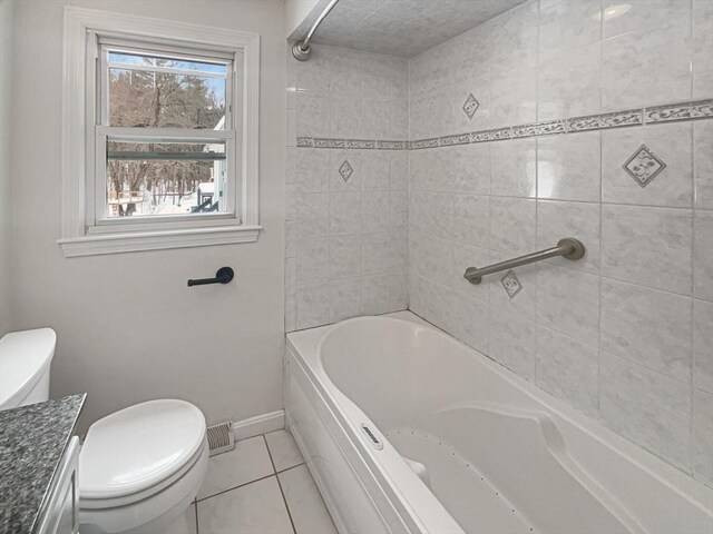 full bathroom featuring toilet, tile patterned flooring, baseboards, and vanity