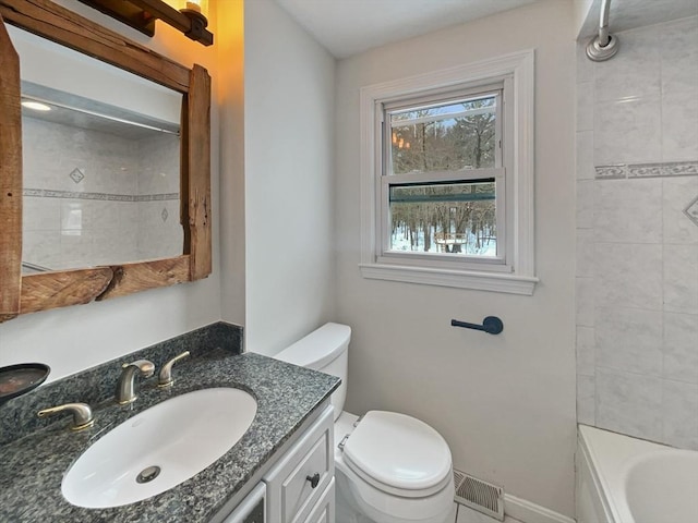 full bathroom with baseboards, visible vents, vanity, and toilet