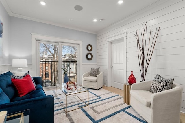 living area featuring ornamental molding, recessed lighting, and wood finished floors