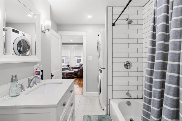 39-41 Ryan St, New Bedford, MA 02740 - bathroom with stacked washer and clothes dryer, recessed lighting, shower / bathtub combination with curtain, and vanity