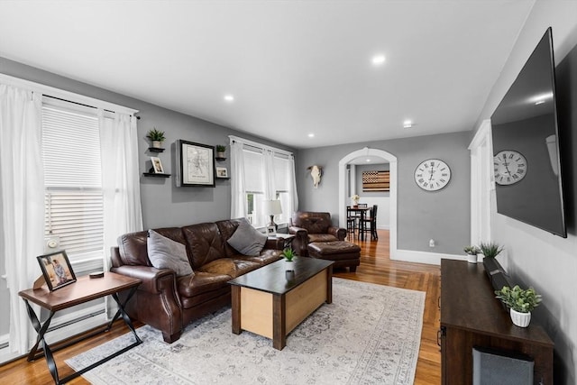 39-41 Ryan St, New Bedford, MA 02740 - living room featuring arched walkways, light wood finished floors, recessed lighting, and baseboard heating