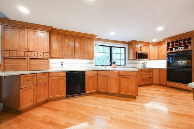 13 Bogastow Cir, Millis, MA 02054 - kitchen featuring black appliances, light wood finished floors, light countertops, and recessed lighting
