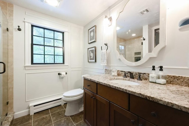 13 Bogastow Cir, Millis, MA 02054 - bathroom with a baseboard radiator, a stall shower, tile patterned floors, vanity, and toilet