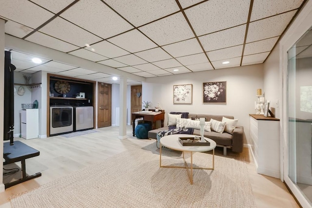 13 Bogastow Cir, Millis, MA 02054 - living area featuring washer and clothes dryer, a drop ceiling, wood finished floors, baseboards, and recessed lighting