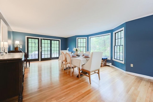 13 Bogastow Cir, Millis, MA 02054 - dining room with light wood-type flooring, ornamental molding, baseboards, and baseboard heating