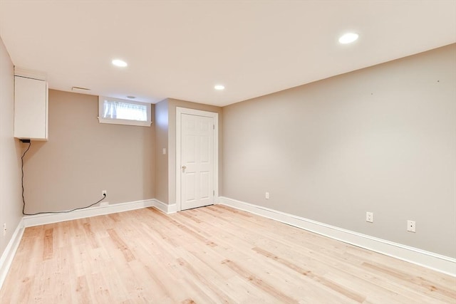 basement with recessed lighting, light wood-style floors, and baseboards
