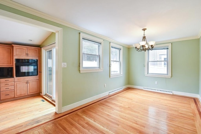 unfurnished dining area featuring baseboards, an inviting chandelier, crown molding, visible vents, and light wood finished floors